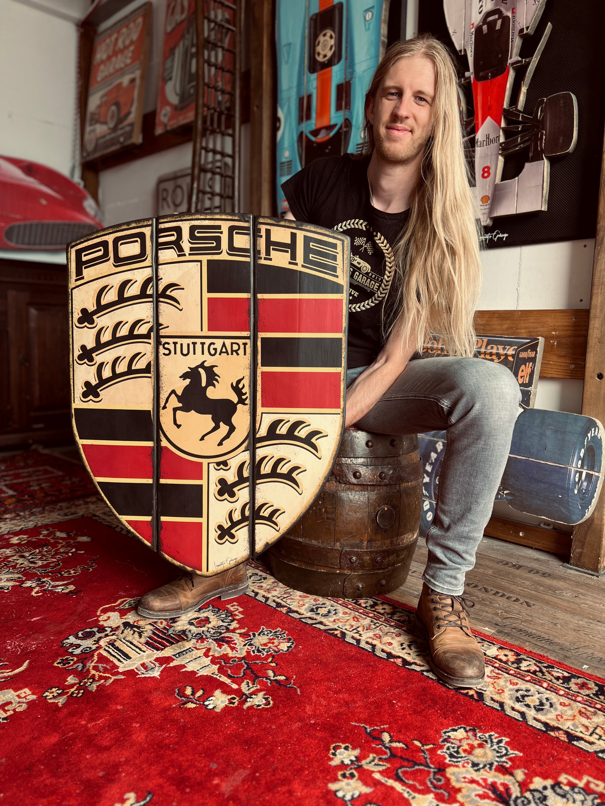 Lennart van Kampen holding the standard Stuttgart Emblem in his workshop