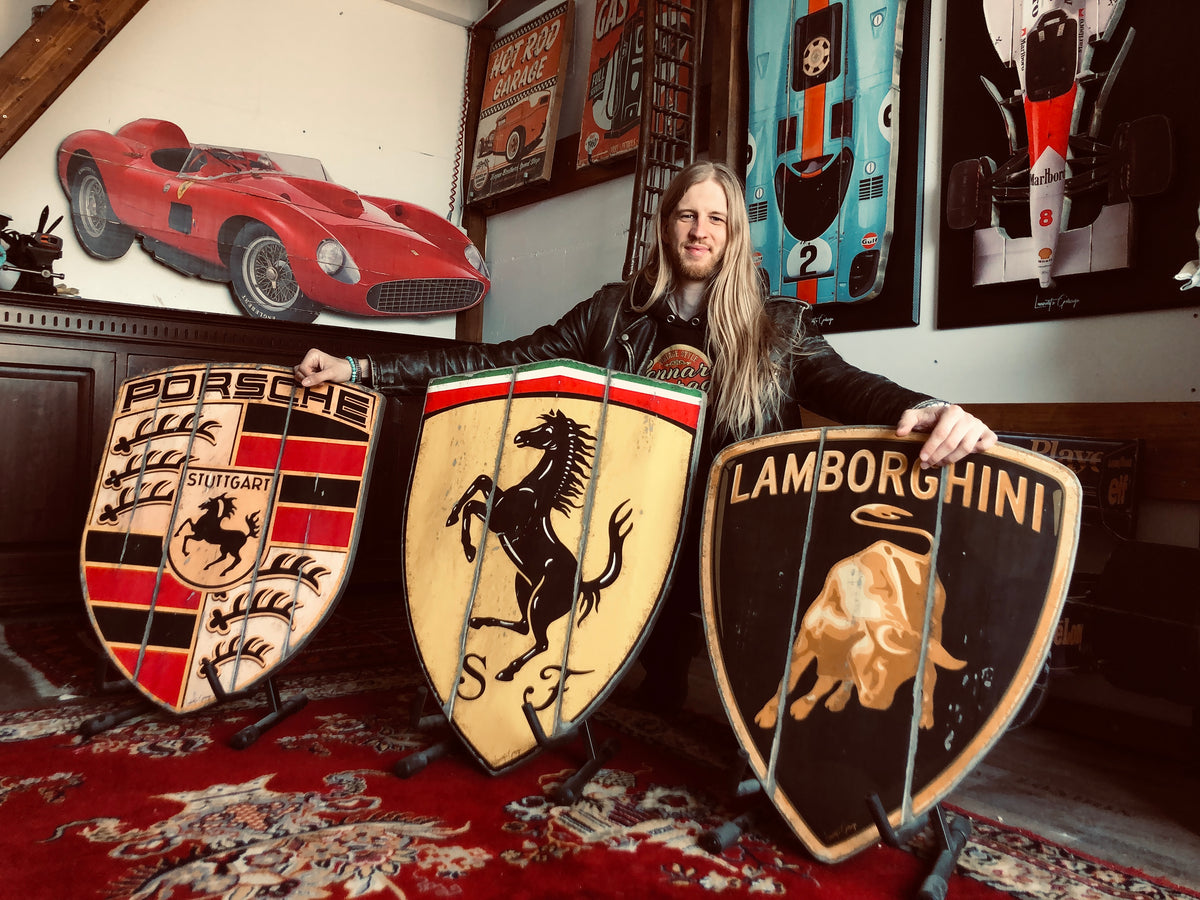 Lennart van Kampen with his handcrafted automotive emblems